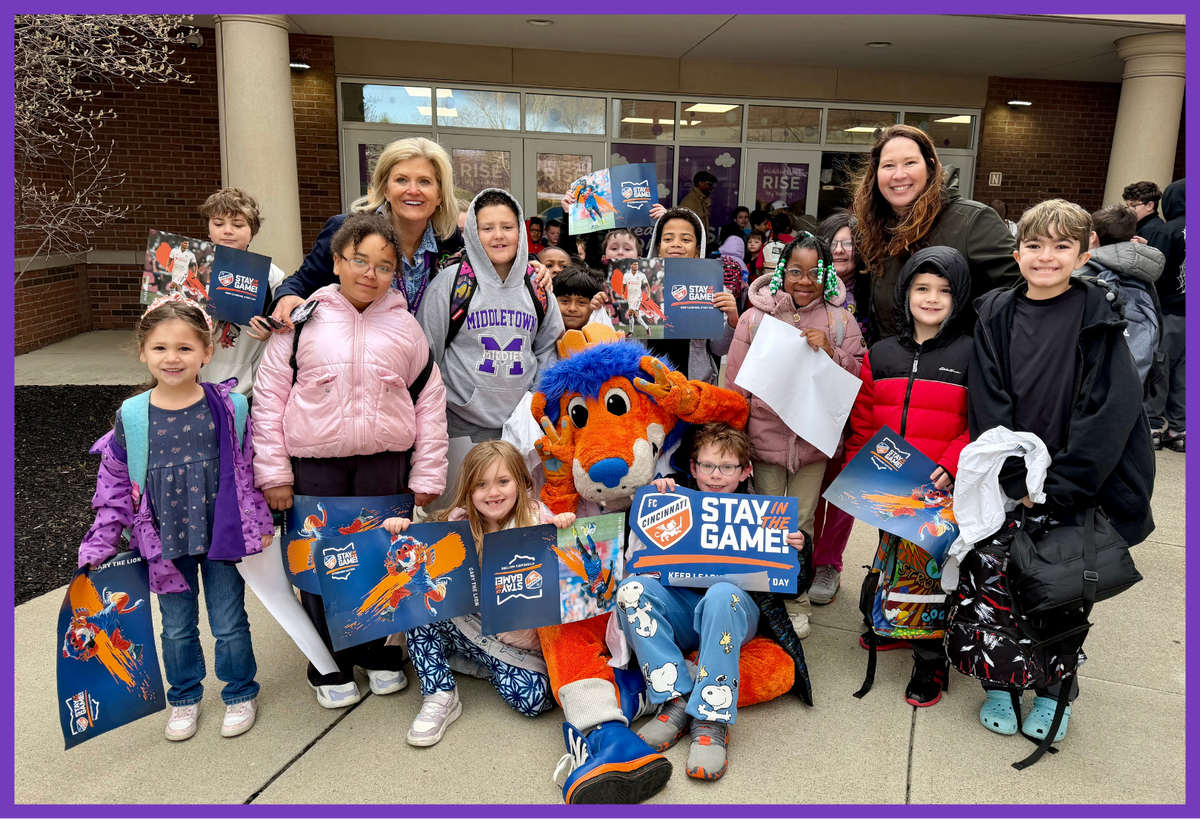 photo of superintendent with a group of students